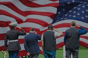Veterans saluting the US flag